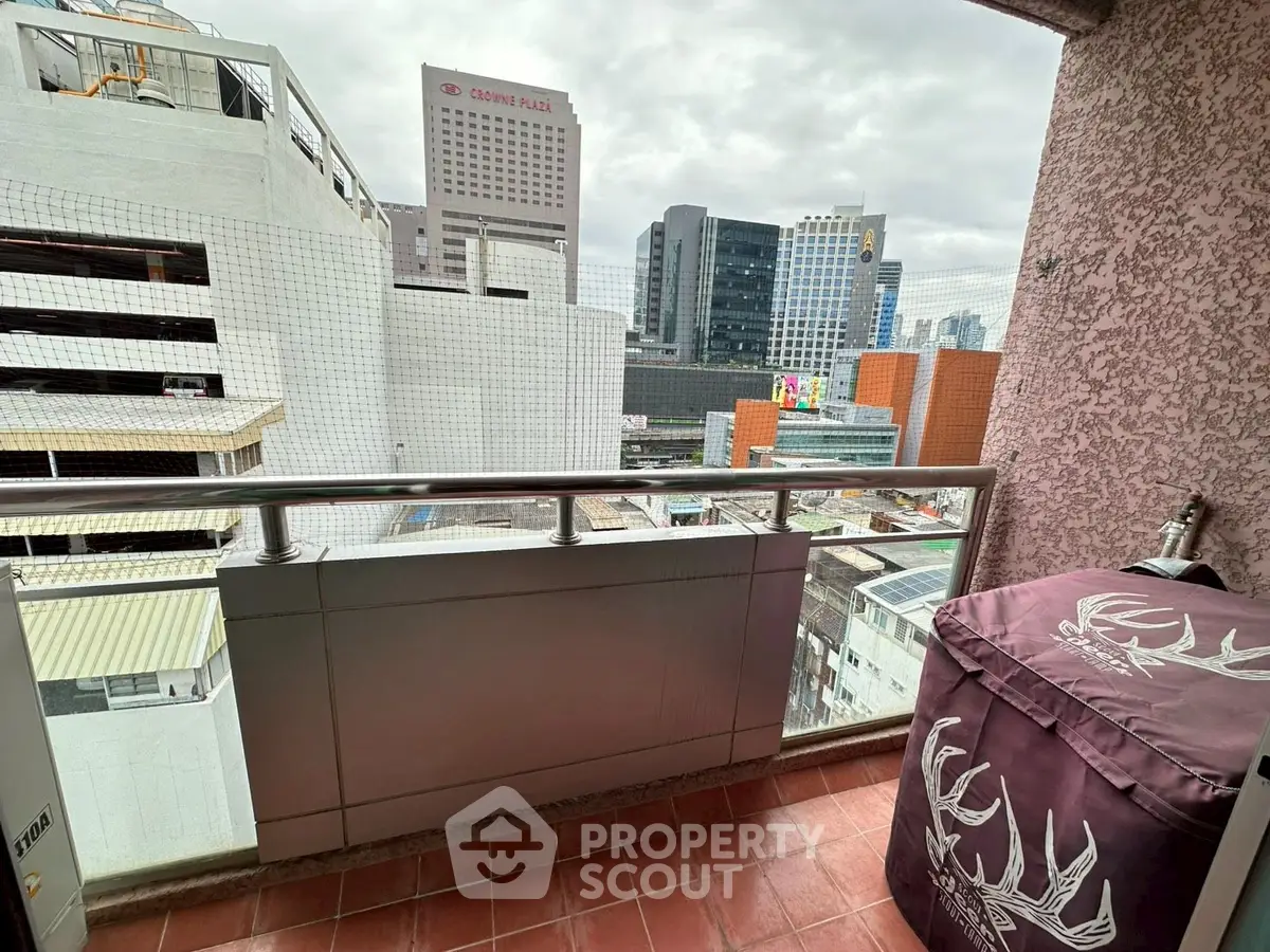 Urban balcony with city view, perfect for enjoying skyline vistas.