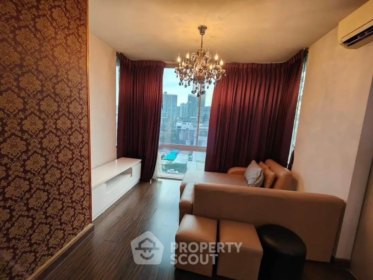 Luxurious living room with elegant chandelier and city view