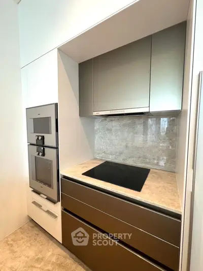Modern kitchen with sleek appliances and elegant marble countertop