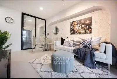 Stylish modern living room with elegant decor and cozy seating area.