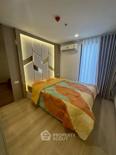 Modern bedroom with stylish decor and natural light