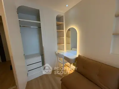Modern bedroom with built-in wardrobe and cozy seating area
