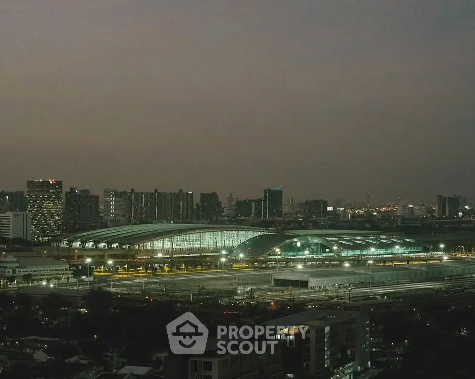 Stunning cityscape view featuring modern architecture and illuminated skyline at dusk.
