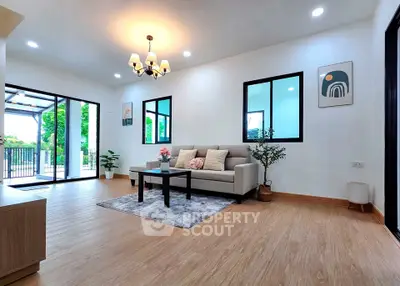 Spacious modern living room with elegant decor and large windows