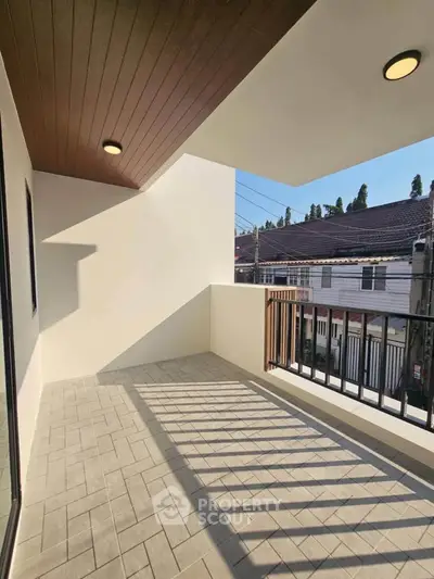 Spacious balcony with modern design and ample sunlight, perfect for relaxation.