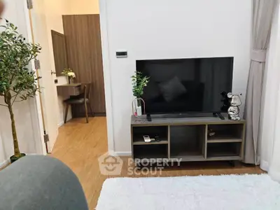 Modern living room with sleek TV stand and cozy decor