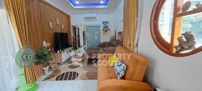 Spacious living room with modern decor and cozy seating area