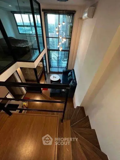 Stunning duplex apartment with high ceilings and modern interior design