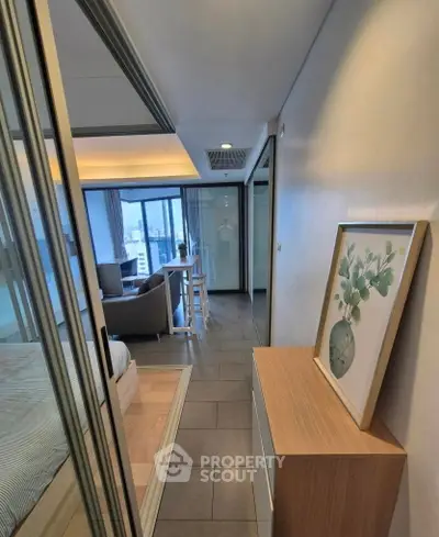 Modern apartment interior with open layout, featuring a cozy living area and stylish decor.