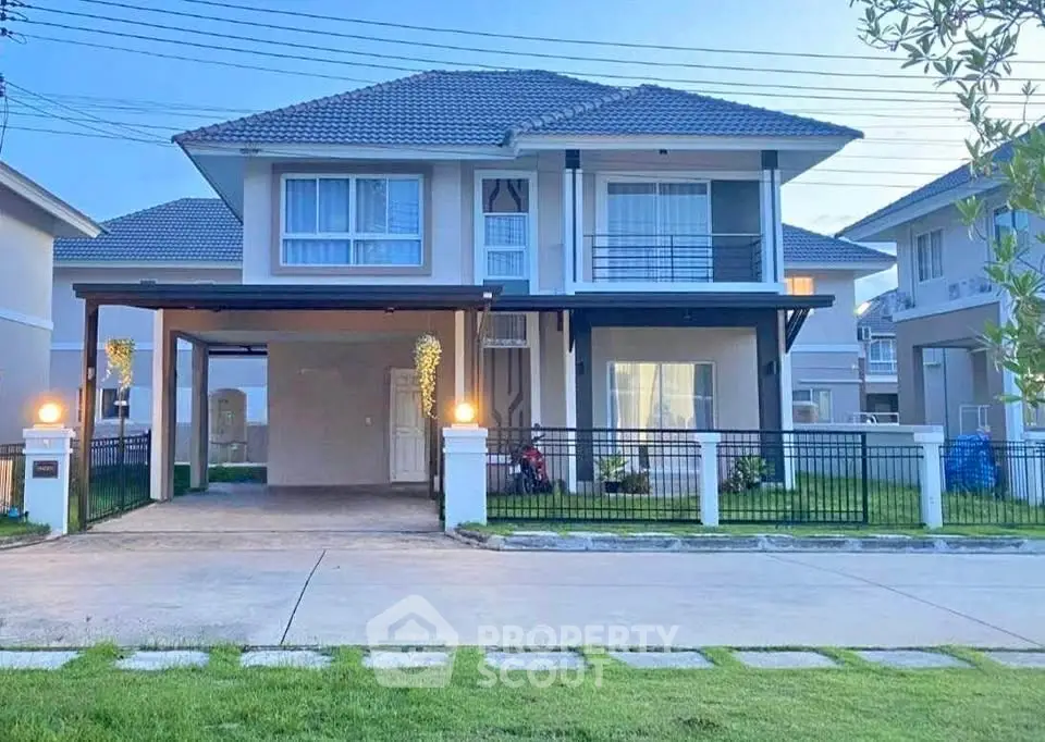 Charming two-story house with modern design and spacious driveway in a serene neighborhood.