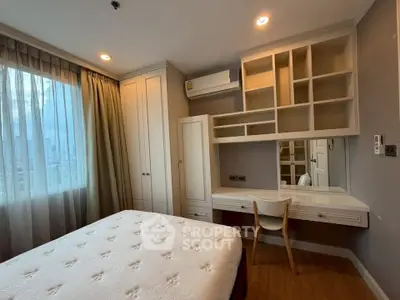 Cozy bedroom with built-in storage and natural light