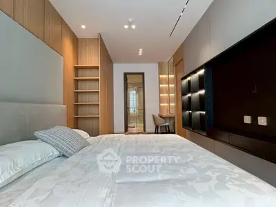 Modern bedroom with sleek design and built-in shelving