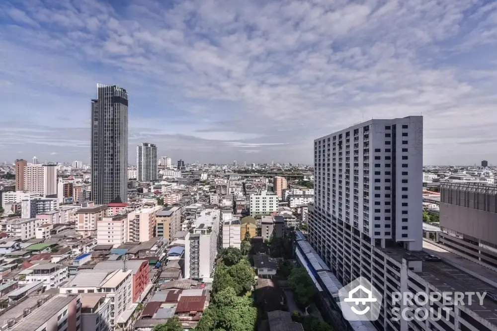 Stunning cityscape view from high-rise building showcasing urban skyline and architectural diversity.