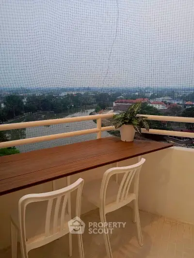 Charming balcony with seating and scenic view, perfect for relaxation and enjoying the outdoors.