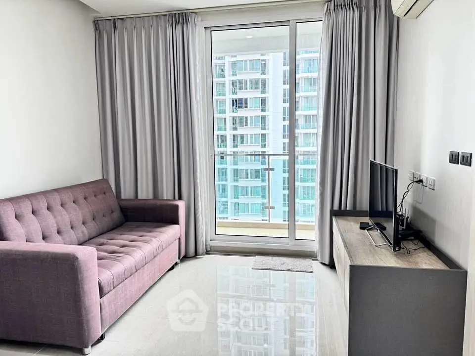 Modern living room with balcony view in high-rise apartment