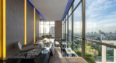 Luxurious high-rise living room with panoramic city views and modern decor