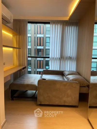 Modern living room with stylish sofa and large window view