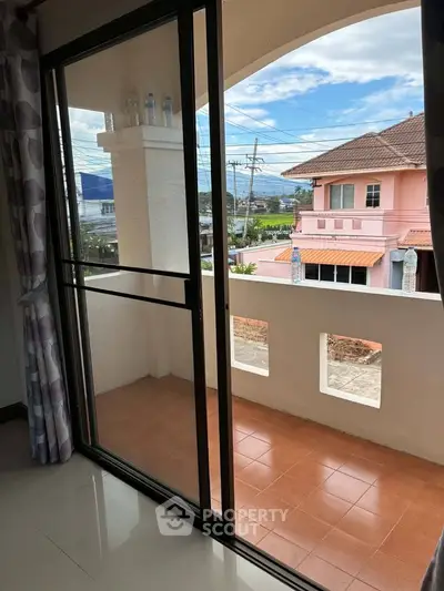 Charming balcony with sliding glass doors and scenic neighborhood view