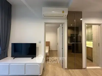 Modern apartment interior with TV, air conditioning, and sleek design