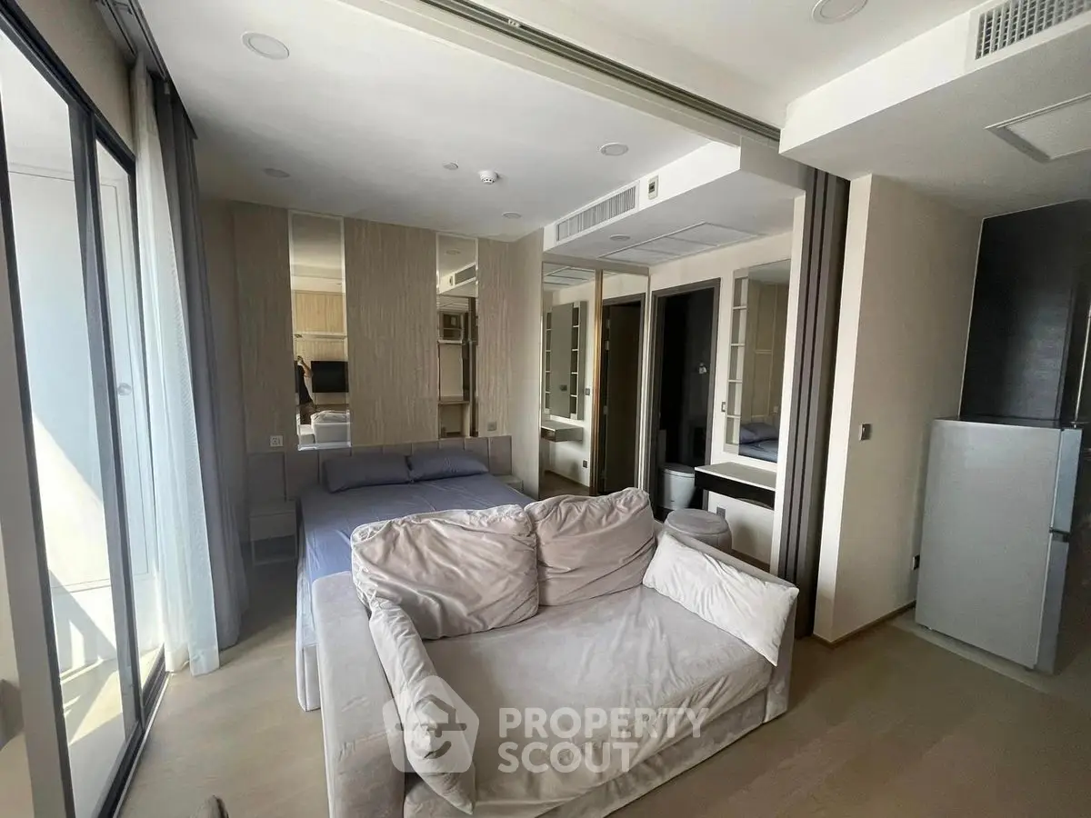 Modern studio apartment with cozy living area and stylish decor
