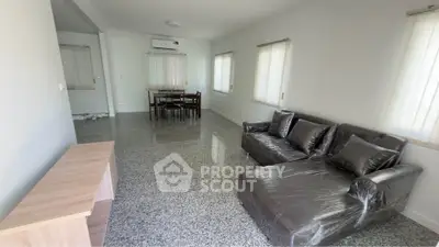 Spacious living room with modern furniture and natural light