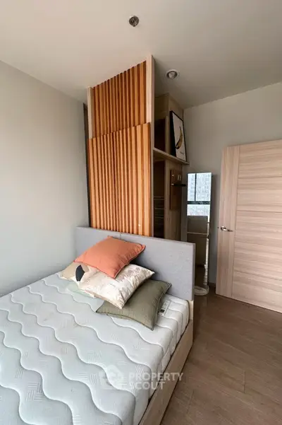 Modern bedroom with stylish wooden accents and cozy bed setup