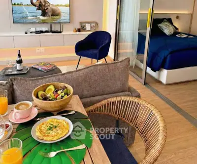 Stylish living room with cozy dining area and modern bedroom view.