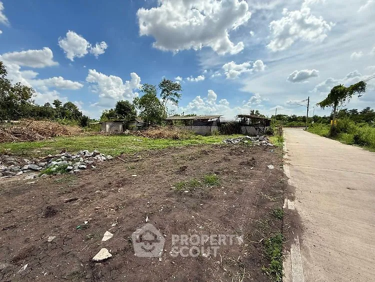 Spacious vacant land with clear skies, ideal for development opportunities.