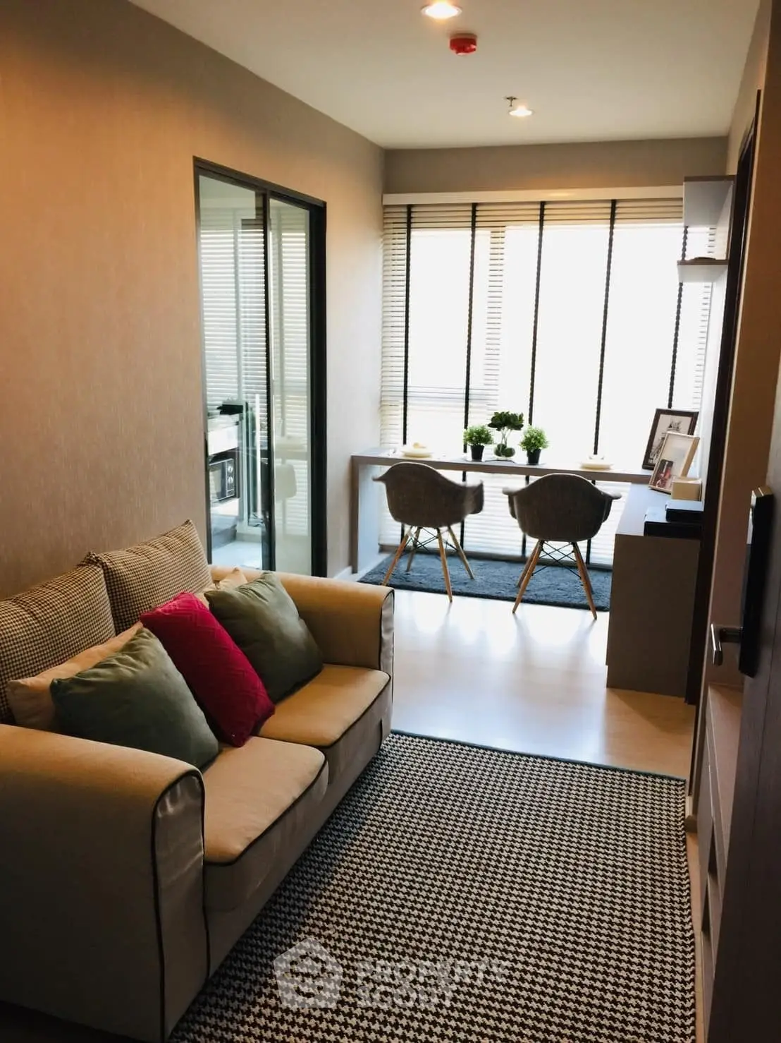 Modern living room with cozy sofa and stylish dining area, perfect for urban living.