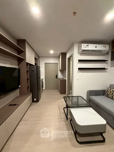 Modern living room with sleek furniture and air conditioning unit