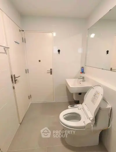 Modern bathroom with smart toilet and sleek design
