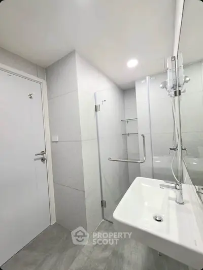 Modern bathroom with sleek design and glass shower enclosure