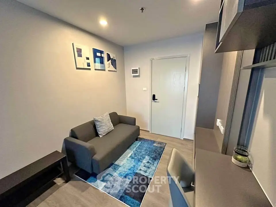 Modern living room with stylish decor and cozy seating in a contemporary apartment.