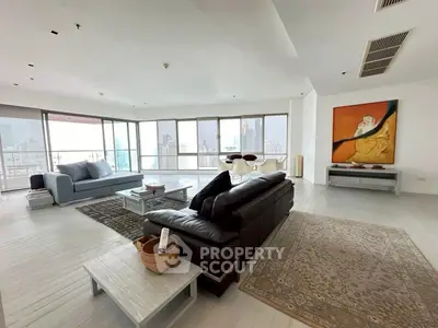 Spacious modern living room with panoramic city views and elegant decor