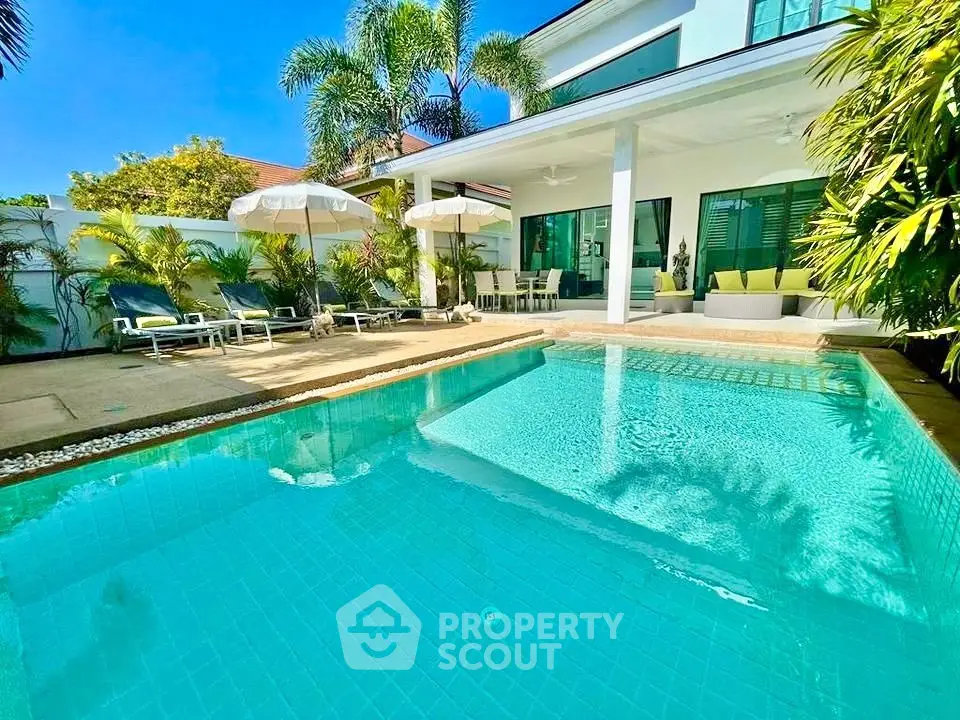 Luxurious villa with private pool and lush garden, perfect for relaxation and entertaining.