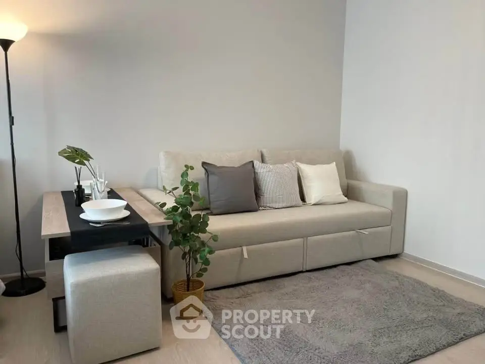 Modern living room with stylish beige sofa and elegant decor
