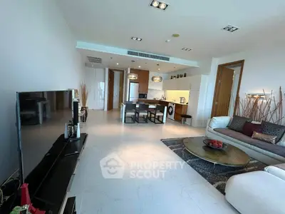 Spacious modern living room with open kitchen and stylish decor