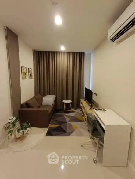 Cozy modern living room with stylish decor and air conditioning