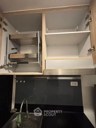 Modern kitchen with sleek cabinets and stainless steel appliances