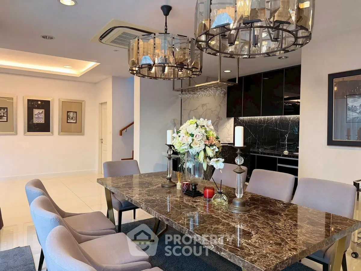 Luxurious dining area with marble table and elegant lighting in modern home