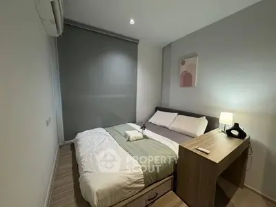 Cozy modern bedroom with stylish decor and natural lighting