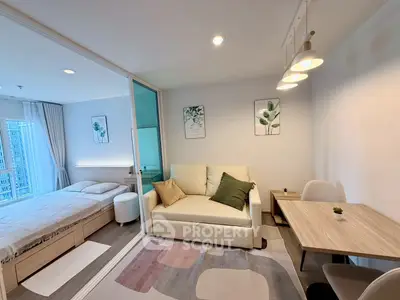 Modern studio apartment with cozy living area and stylish decor