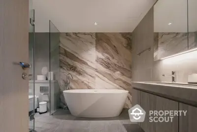 Luxurious modern bathroom with elegant freestanding bathtub and marble accents