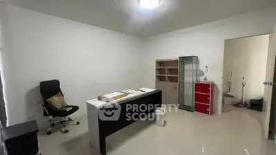 Spacious home office with modern desk and chair, ideal for productivity and comfort.