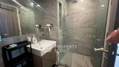 Modern bathroom with glass shower and sleek vanity
