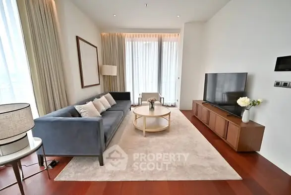 Elegant living room with modern furniture and large windows