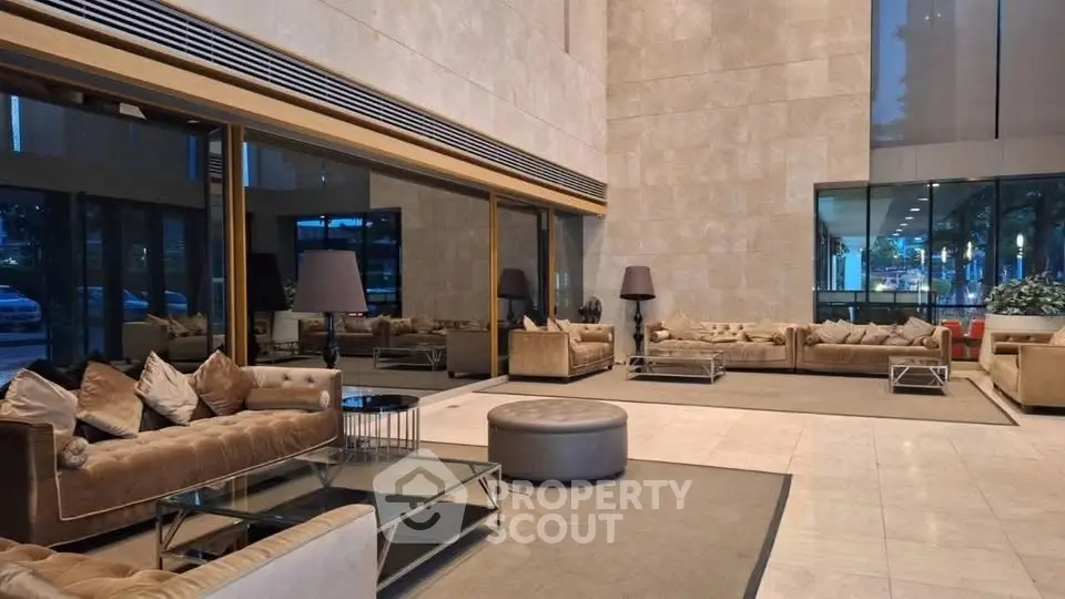 Luxurious lobby with modern seating and elegant decor in a high-end building.
