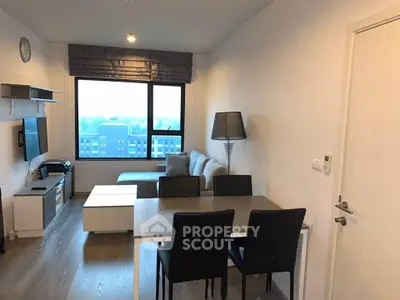 Modern living room with stylish furniture and large window view