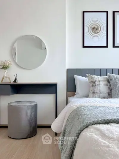 Modern bedroom with stylish decor and cozy bedding