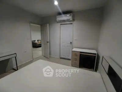 Modern bedroom with minimalist design and air conditioning unit